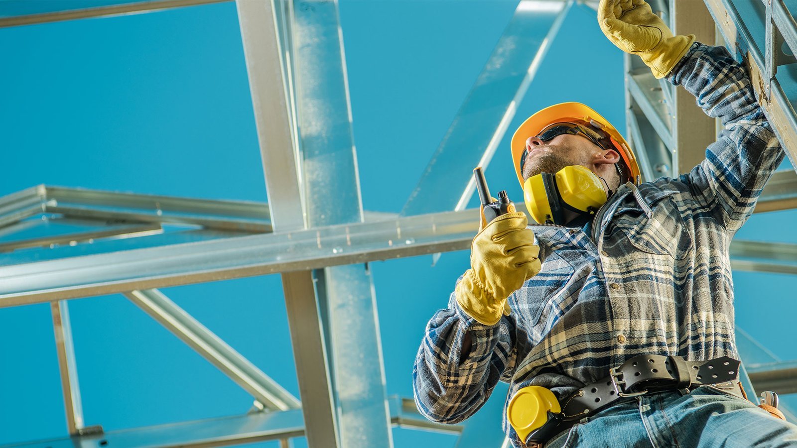 Construction specialist installing a steel building frame